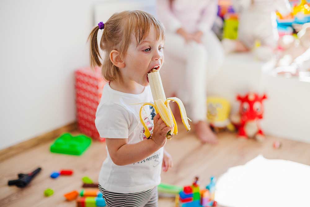Child-eating-a-banana