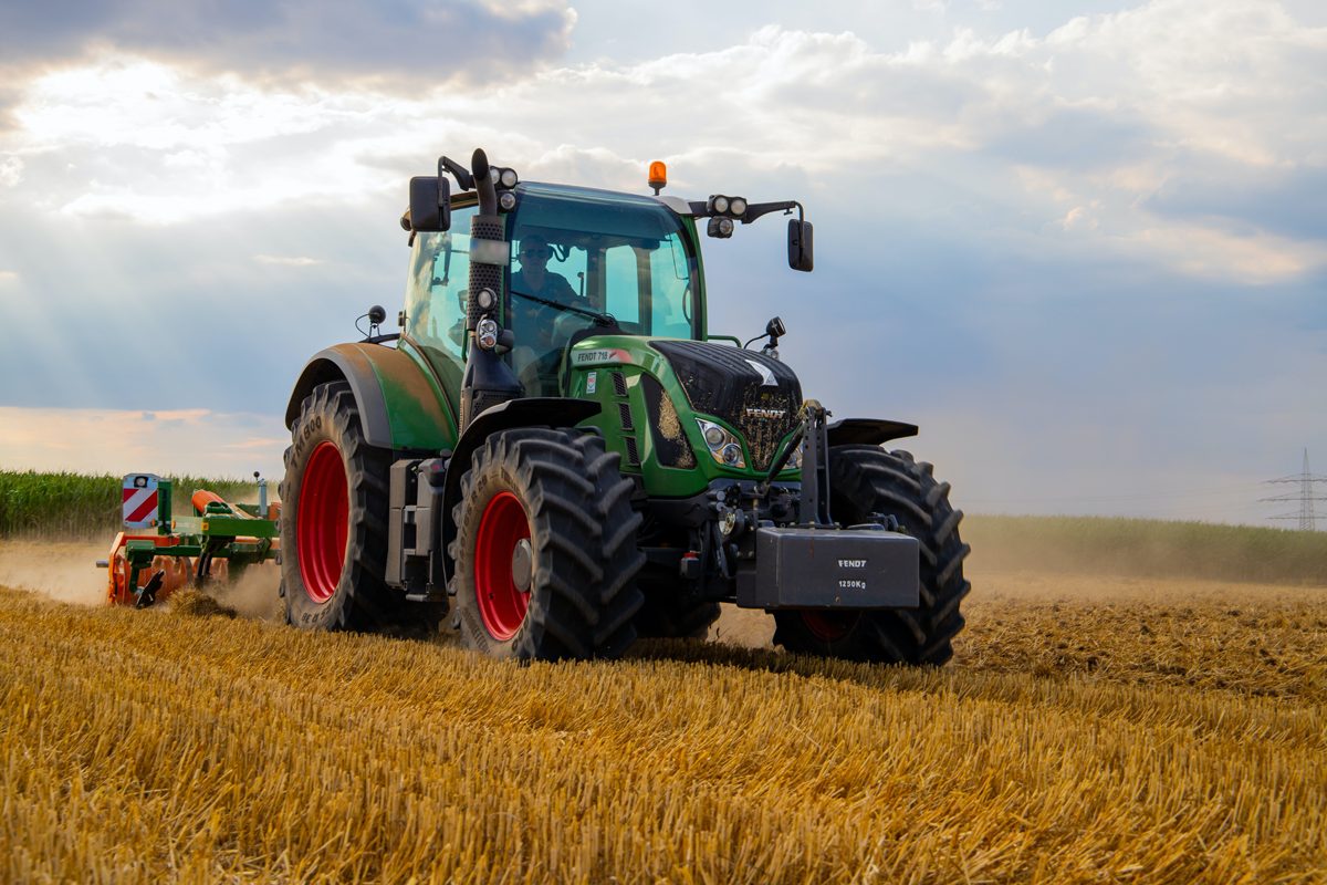 Image of farmer on tractor in field