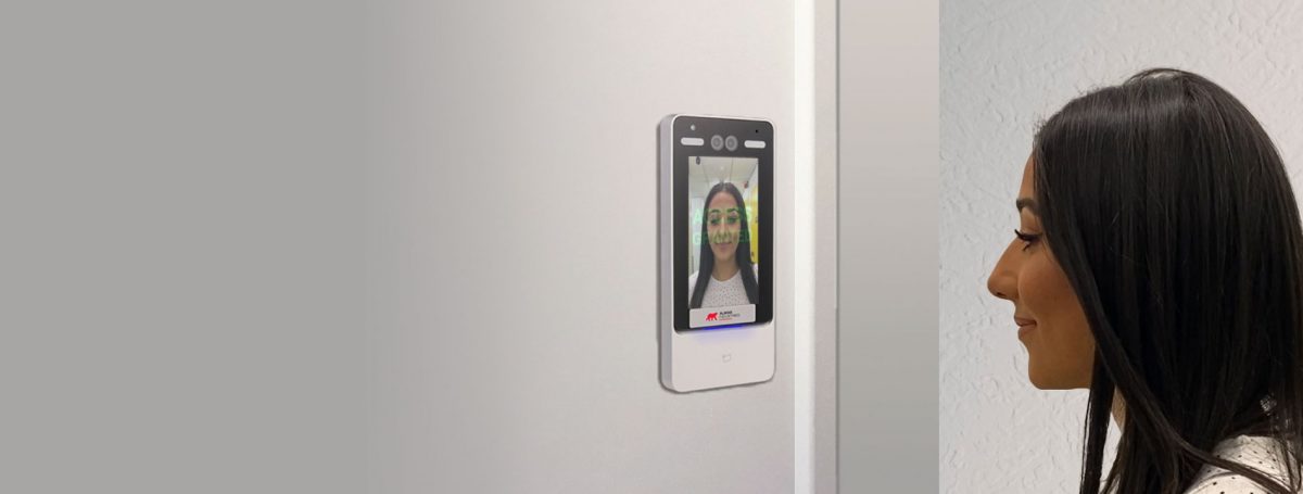 image of a woman looking at a facial recognition reader