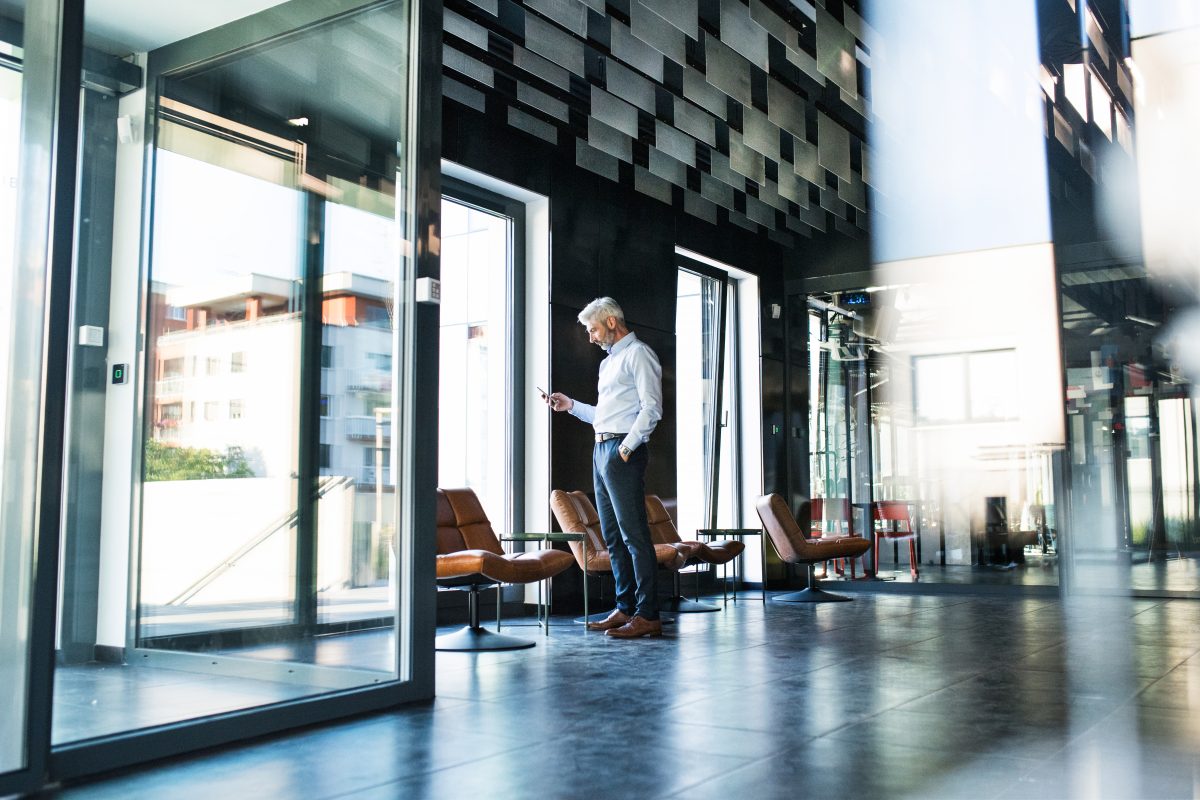 Businessman with smartphone in the office.