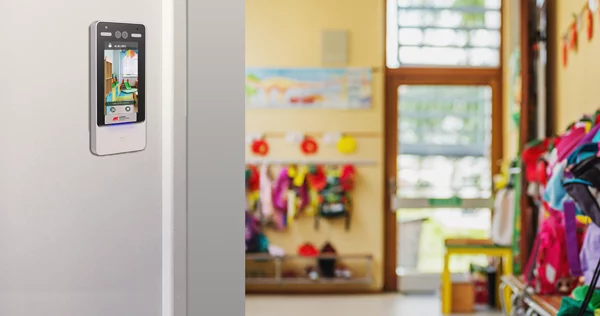 facial access control reader on wall in a nursery entrance