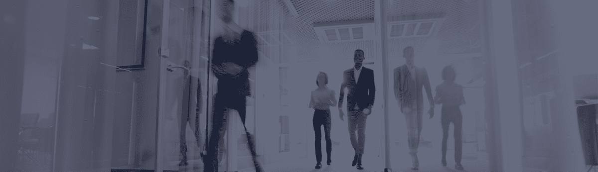 business people walking down corridor blurred