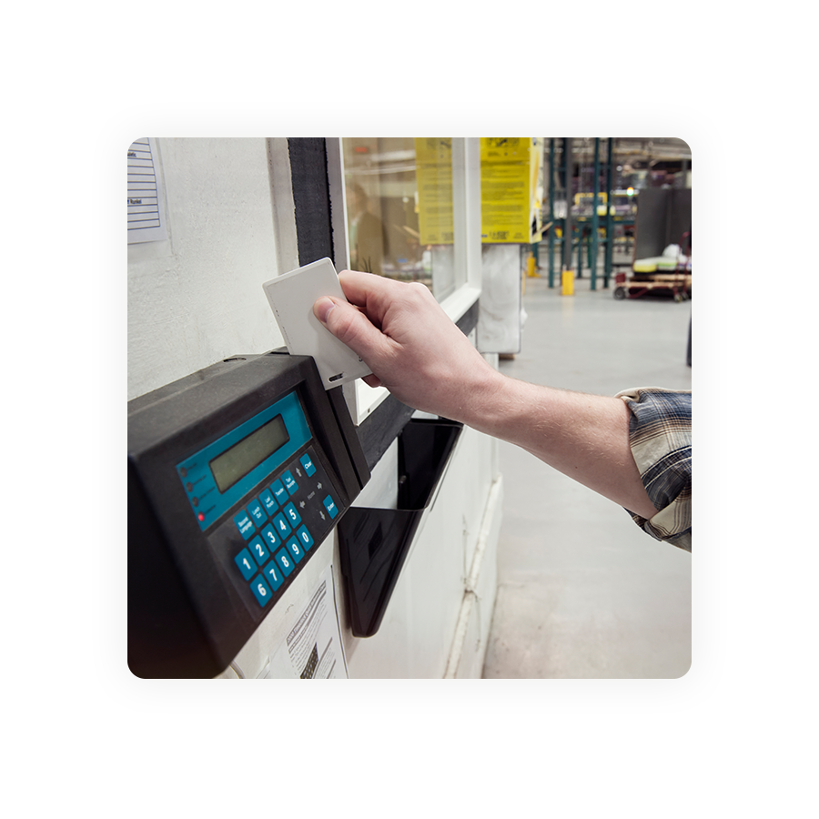 person using a swipe card clock in machine